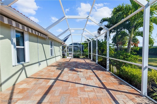 unfurnished sunroom with lofted ceiling