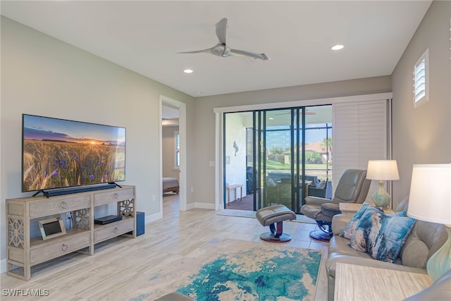 living room featuring ceiling fan