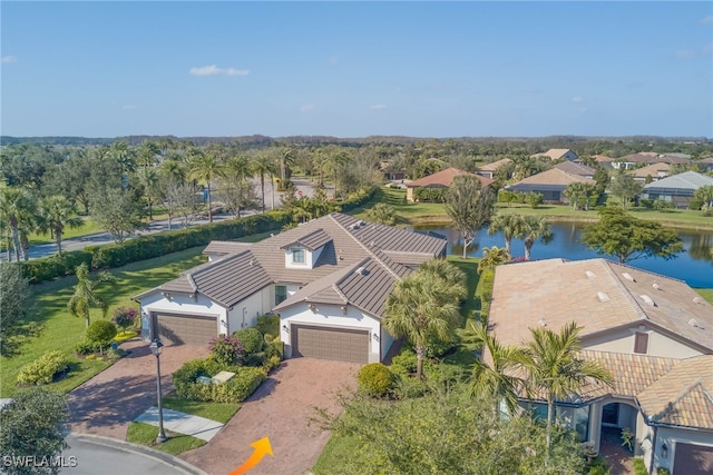 birds eye view of property with a water view