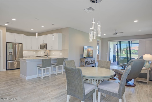 dining area with ceiling fan