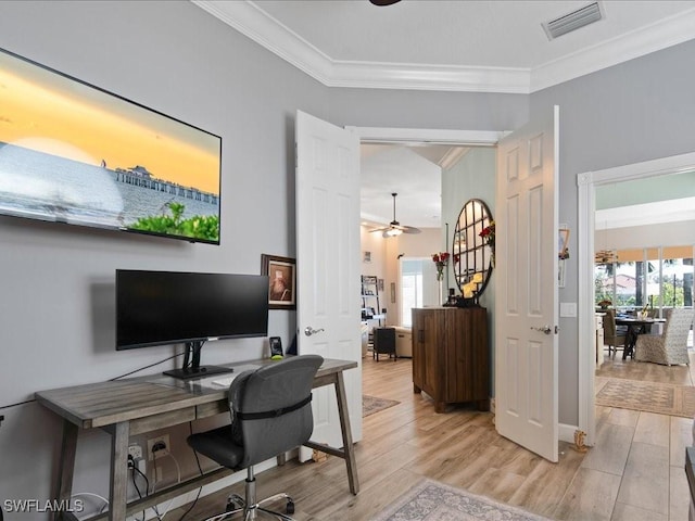 office space featuring ornamental molding, ceiling fan, and light hardwood / wood-style flooring