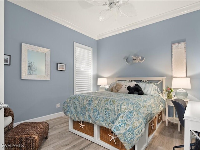 bedroom featuring ceiling fan, light hardwood / wood-style floors, and ornamental molding