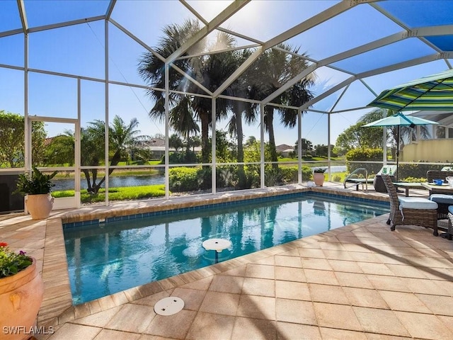 view of swimming pool featuring a lanai, a patio, and a water view