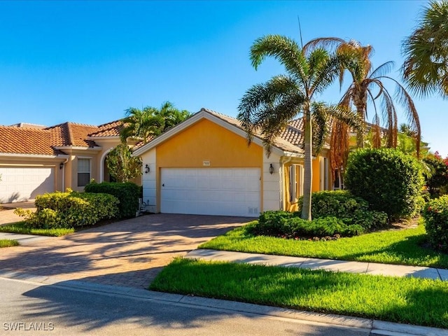 mediterranean / spanish-style house featuring a garage