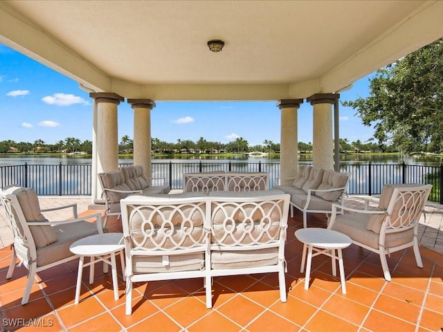 view of patio featuring an outdoor living space and a water view