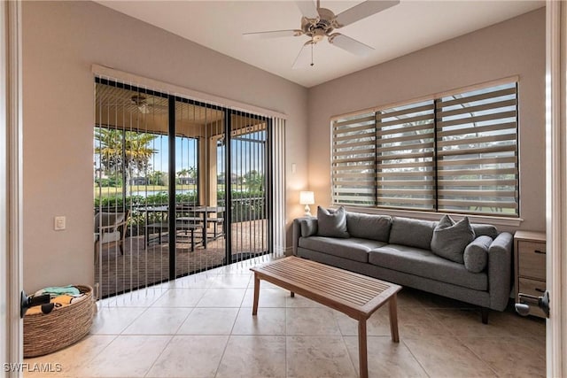 tiled living room with ceiling fan