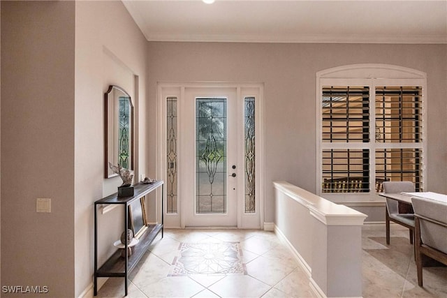 tiled foyer with ornamental molding