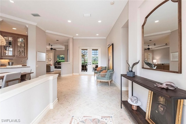 hall with sink, ornamental molding, and french doors