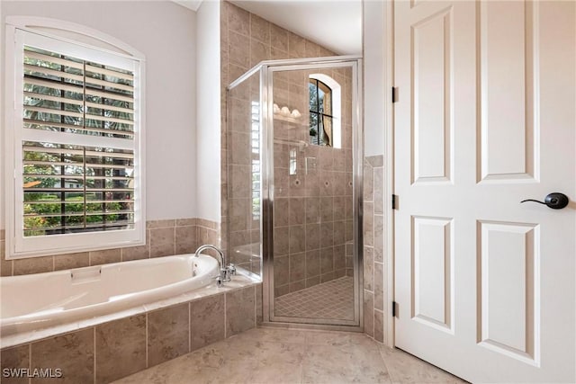 bathroom featuring shower with separate bathtub and tile patterned floors