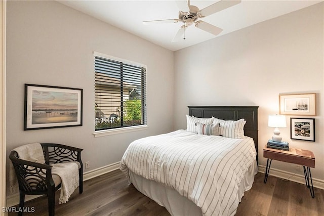 bedroom with ceiling fan and dark hardwood / wood-style flooring