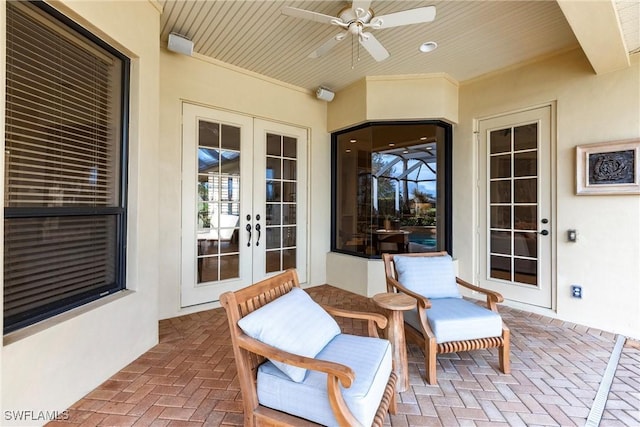 view of patio with ceiling fan and french doors