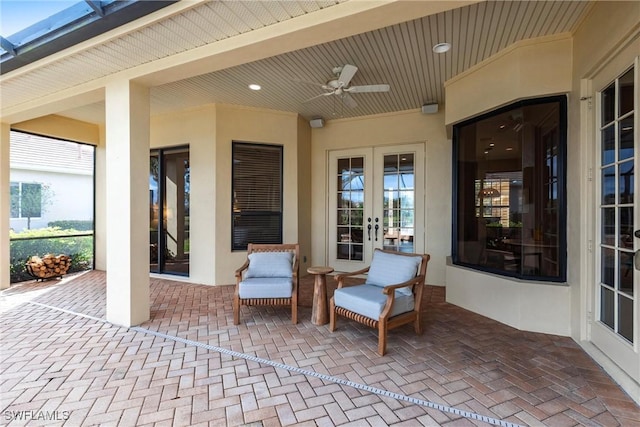 view of patio / terrace with ceiling fan and french doors