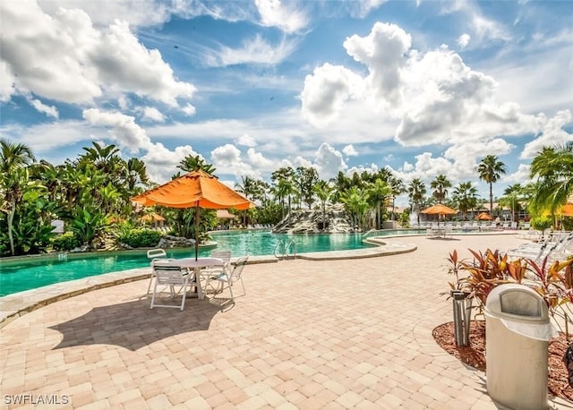 view of swimming pool with a patio area