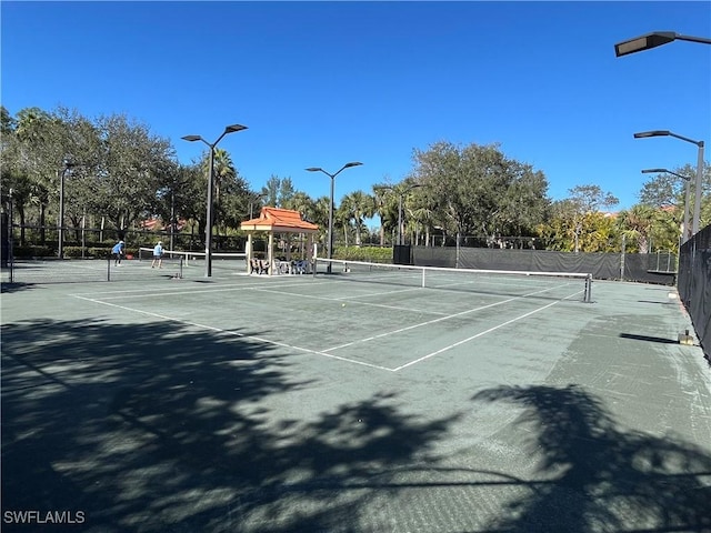 view of tennis court featuring a gazebo