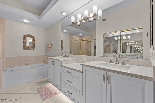 bathroom featuring vanity, separate shower and tub, a chandelier, and tile patterned floors