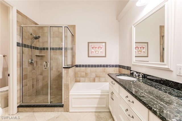 full bathroom featuring vanity, separate shower and tub, tile patterned floors, and toilet