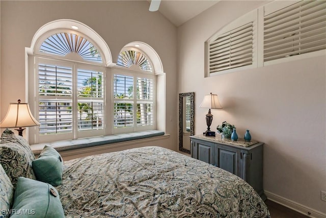 bedroom with high vaulted ceiling and ceiling fan