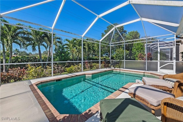 view of pool featuring a lanai and a patio