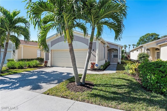 view of front of home featuring a front yard and a garage