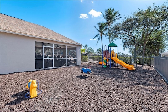 view of playground featuring a sunroom