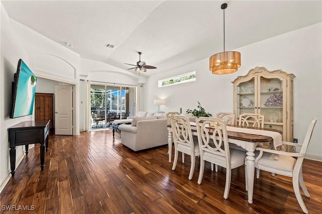 dining space with vaulted ceiling, ceiling fan, and dark hardwood / wood-style floors