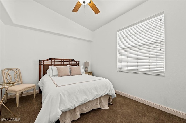 carpeted bedroom with ceiling fan and lofted ceiling