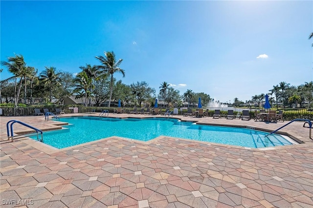 view of swimming pool featuring a patio area