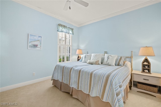 carpeted bedroom with ceiling fan and crown molding