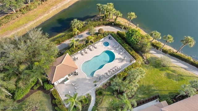 birds eye view of property with a water view