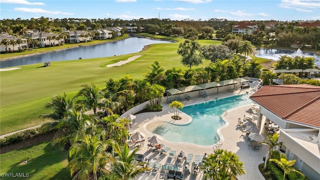 birds eye view of property with a water view