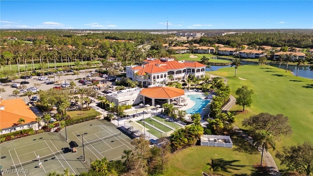 birds eye view of property with a water view