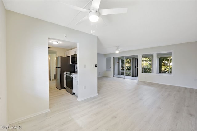 unfurnished living room featuring ceiling fan and light hardwood / wood-style floors