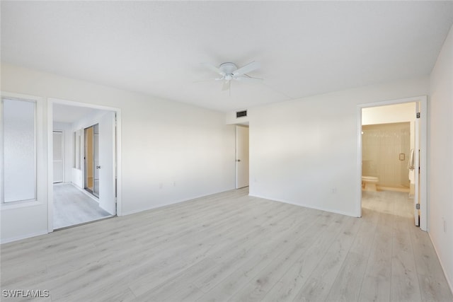 spare room with ceiling fan and light wood-type flooring