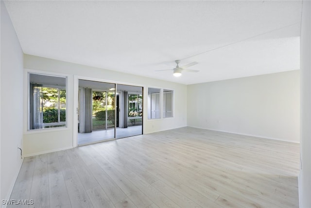 unfurnished room with ceiling fan and light hardwood / wood-style floors