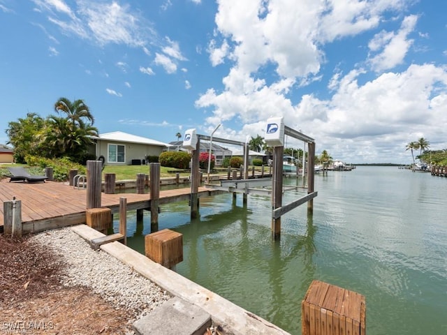 view of dock featuring a water view and boat lift