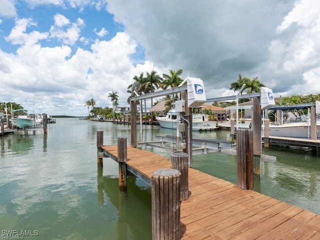 view of dock featuring a water view and boat lift