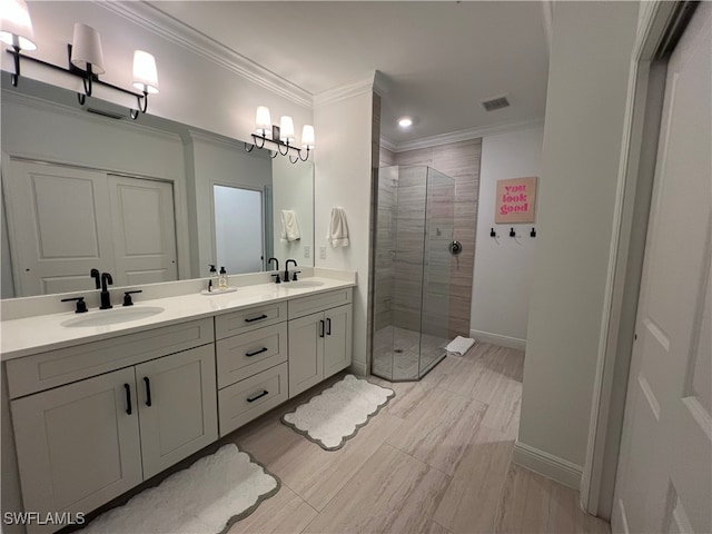 bathroom featuring vanity, tiled shower, and ornamental molding