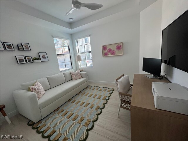 office featuring ceiling fan and light hardwood / wood-style flooring