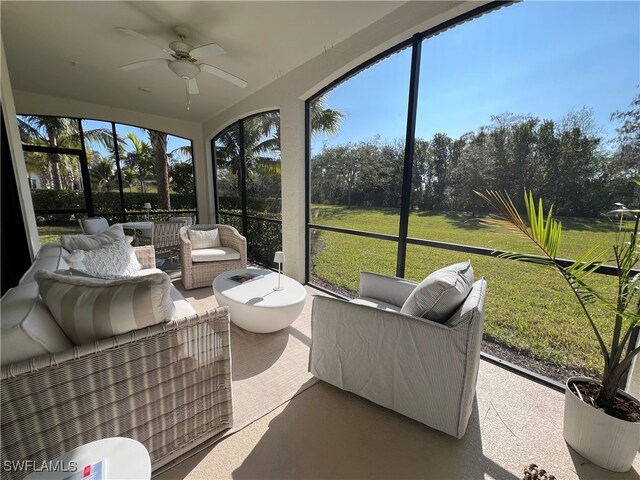 sunroom with ceiling fan