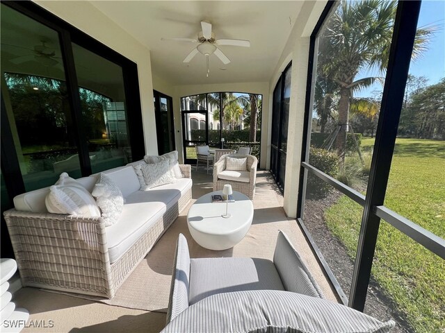 sunroom with ceiling fan and plenty of natural light