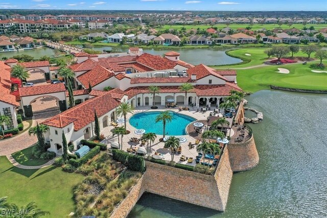 birds eye view of property with a water view