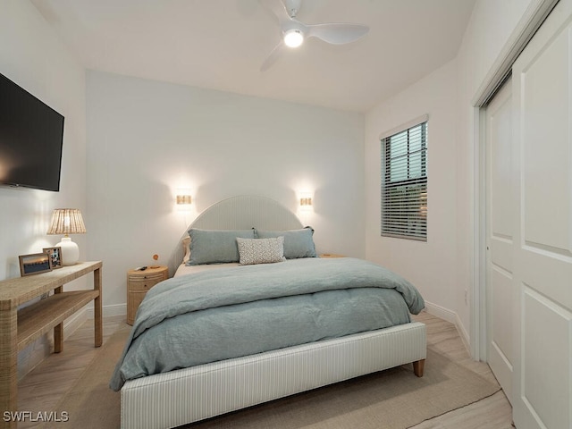 bedroom featuring ceiling fan and a closet