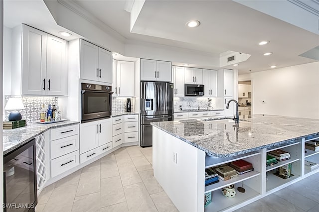 kitchen featuring wine cooler, crown molding, open shelves, appliances with stainless steel finishes, and a sink