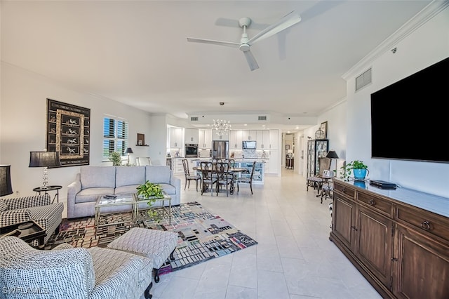 tiled living room featuring ceiling fan and ornamental molding