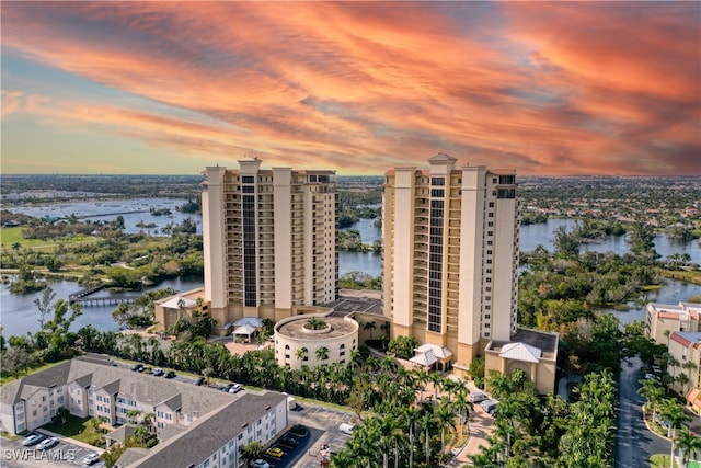 aerial view at dusk with a water view