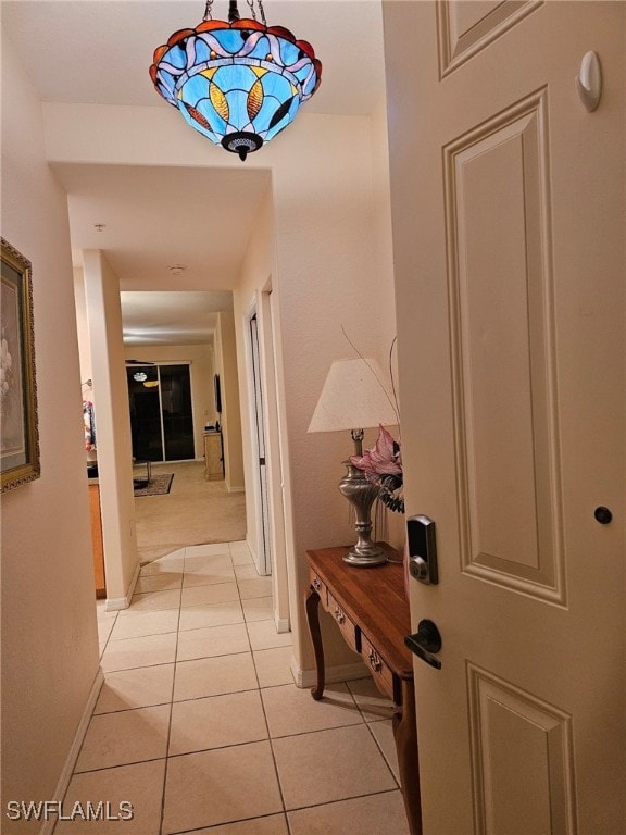 corridor with light tile patterned flooring