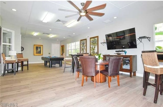 dining room with ceiling fan and light hardwood / wood-style floors