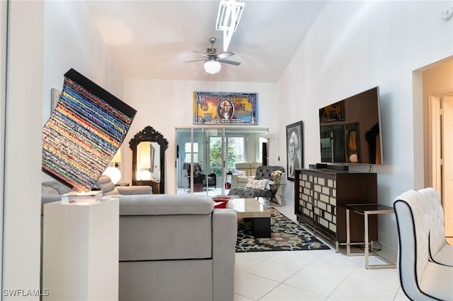 living room featuring ceiling fan and light tile patterned floors