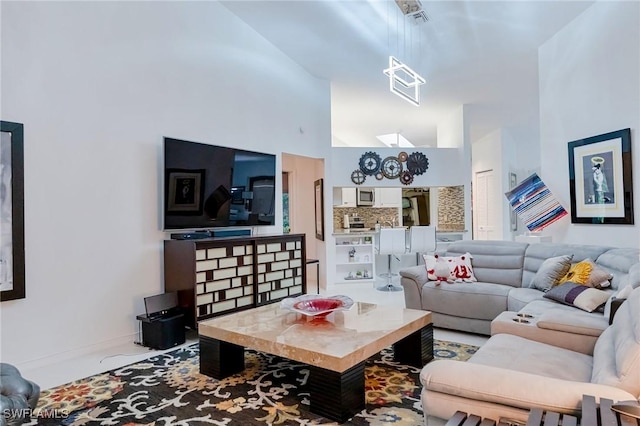 living room with a towering ceiling