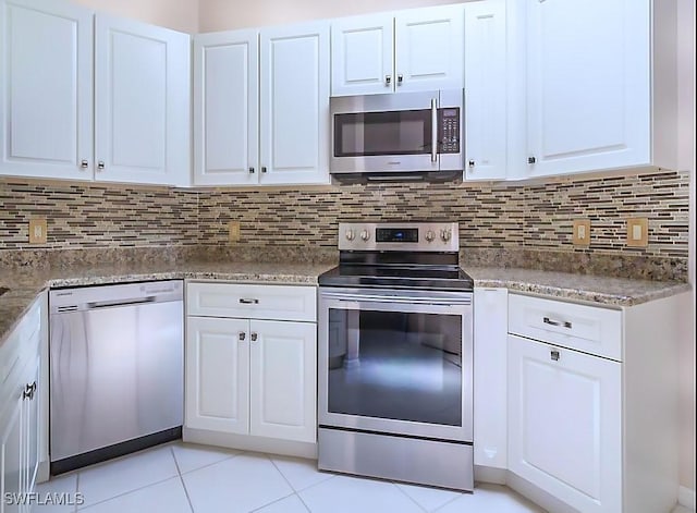 kitchen featuring tasteful backsplash, white cabinetry, and stainless steel appliances